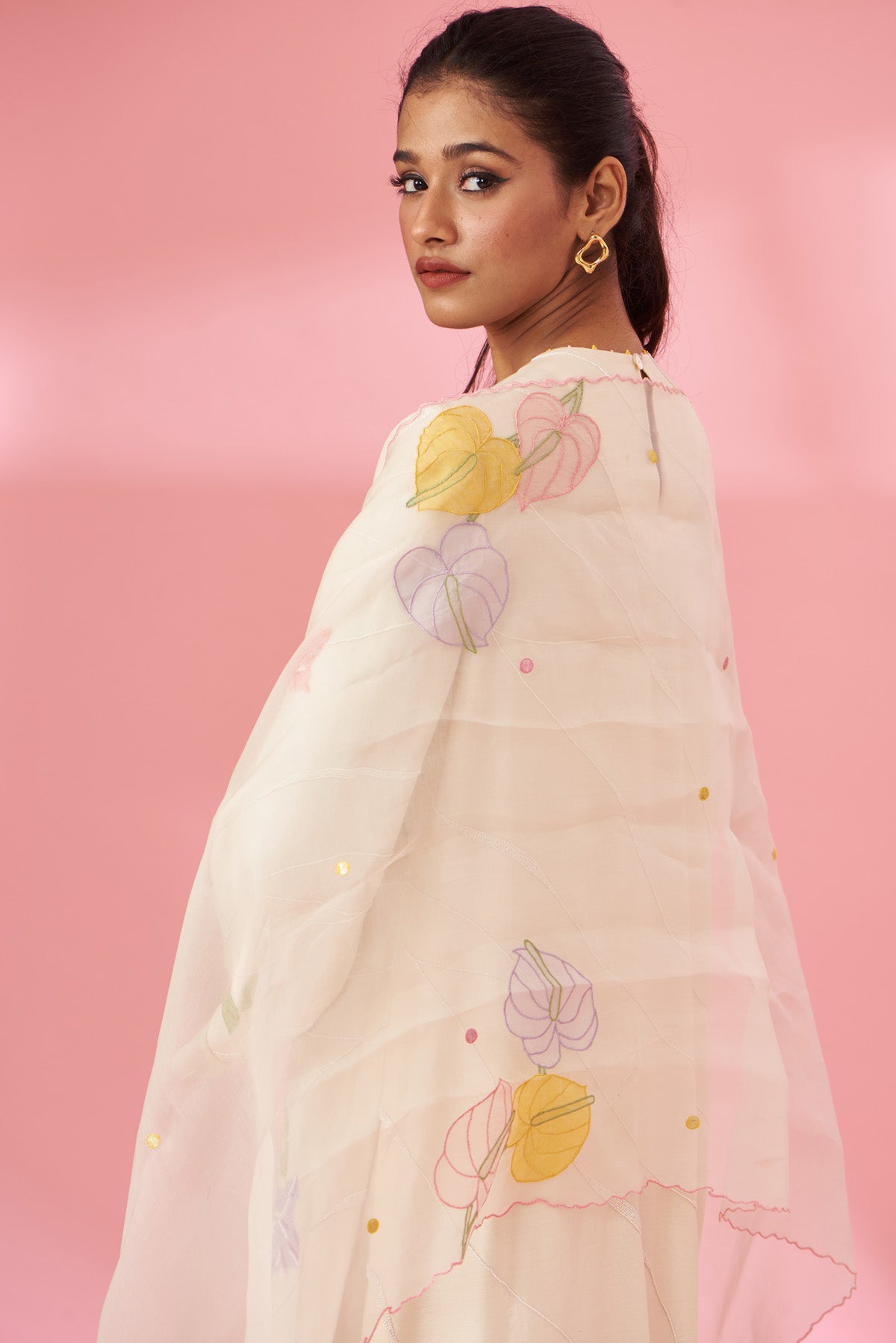 Colorful floral applique work and hand embroidered suit set