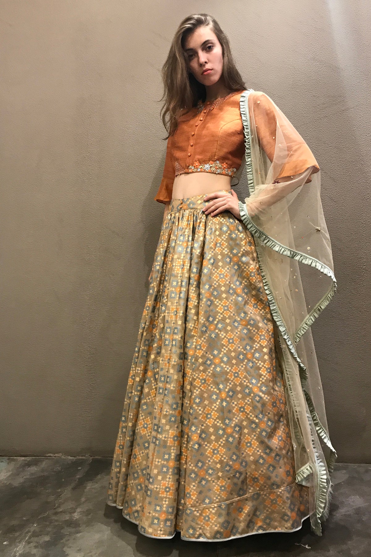 Dust orange & gold ikat  printed & embroidered  lehenga set