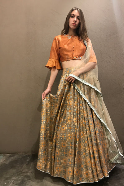 Dust orange & gold ikat  printed & embroidered  lehenga set