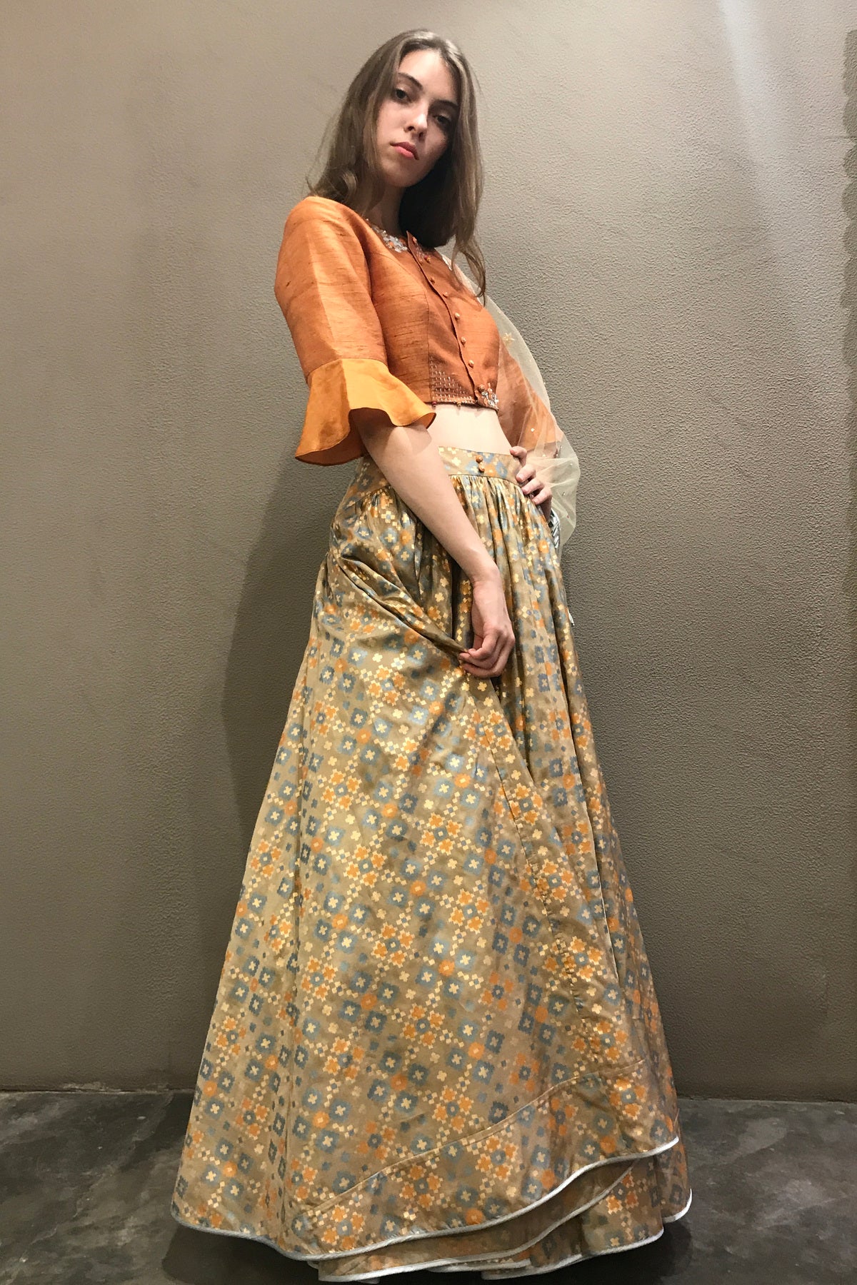 Dust orange & gold ikat  printed & embroidered  lehenga set