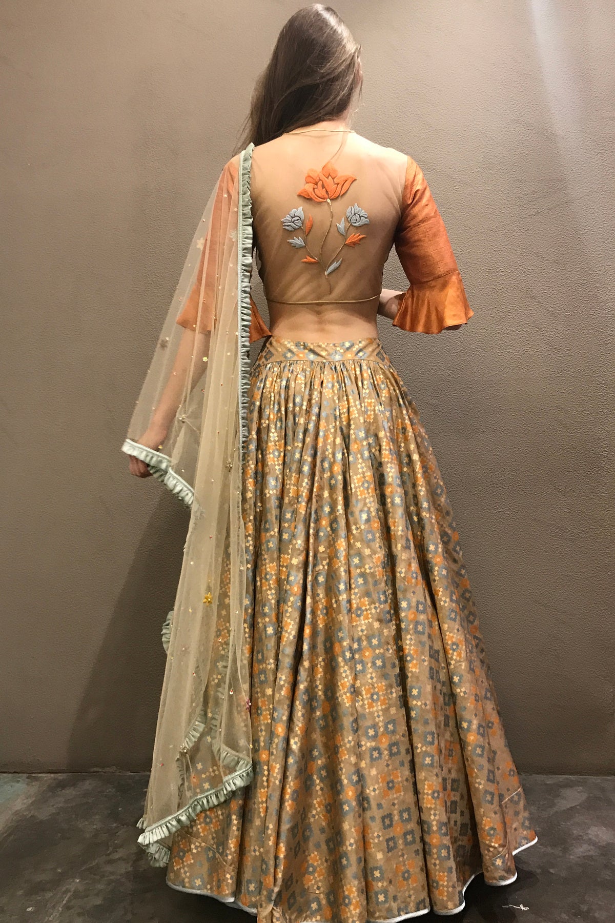 Dust orange & gold ikat  printed & embroidered  lehenga set